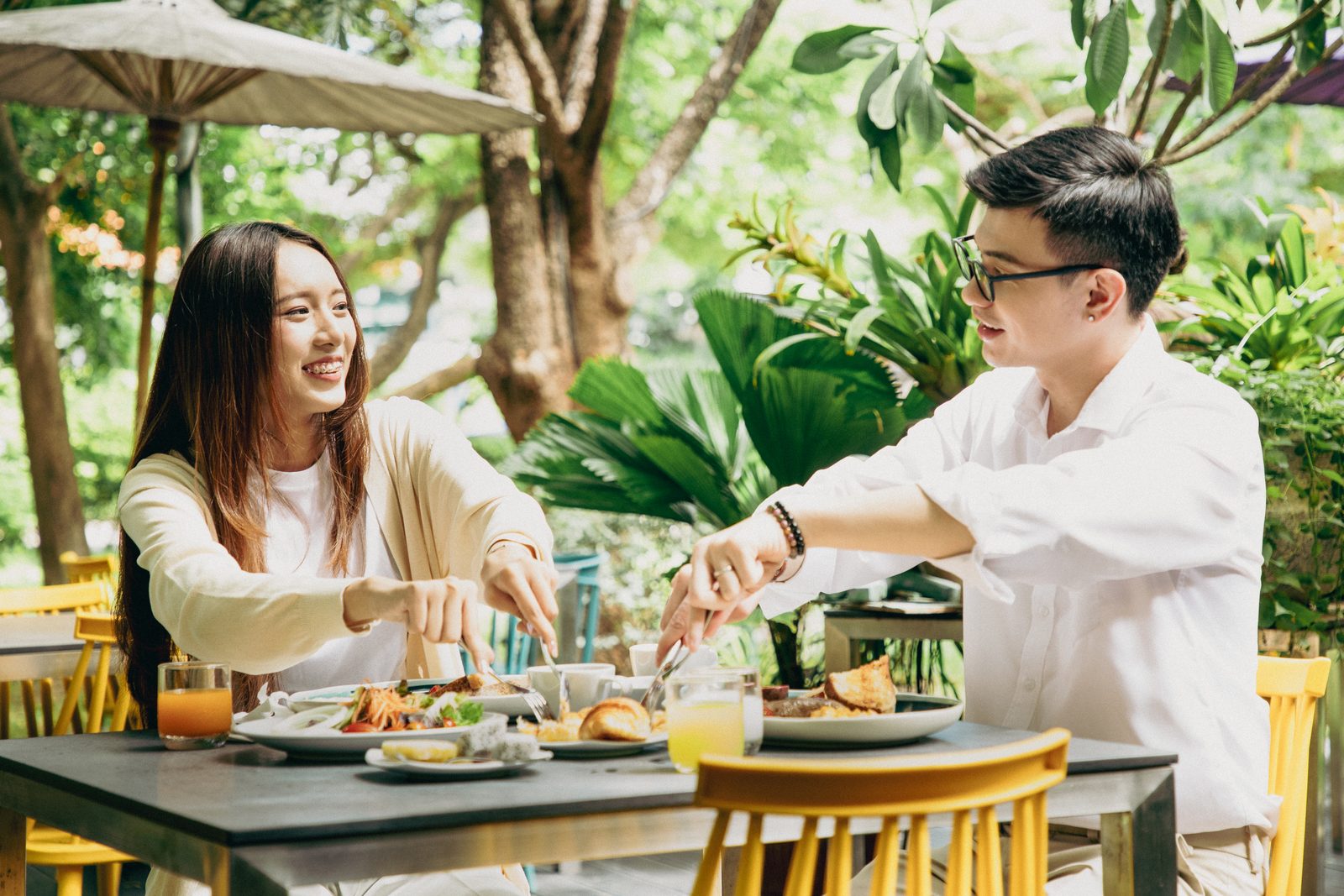 Couple enjoying breakfast in the garden