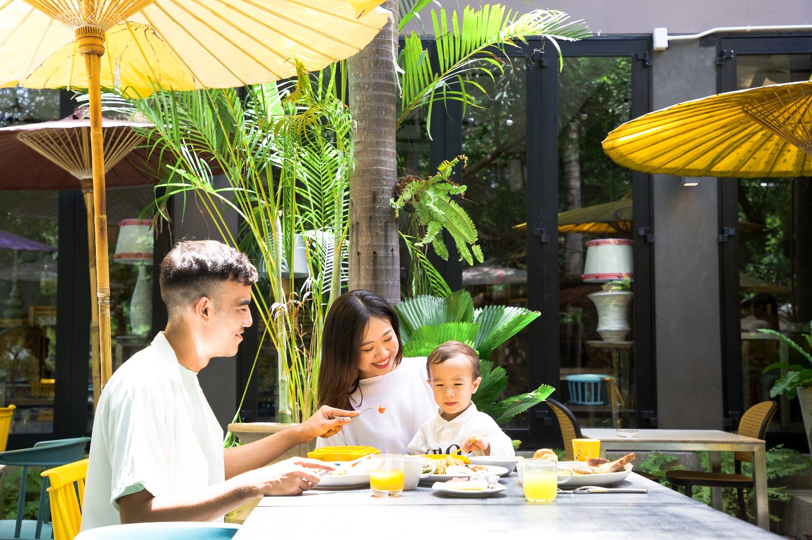 Family enjoying breakfast on the garden terrace